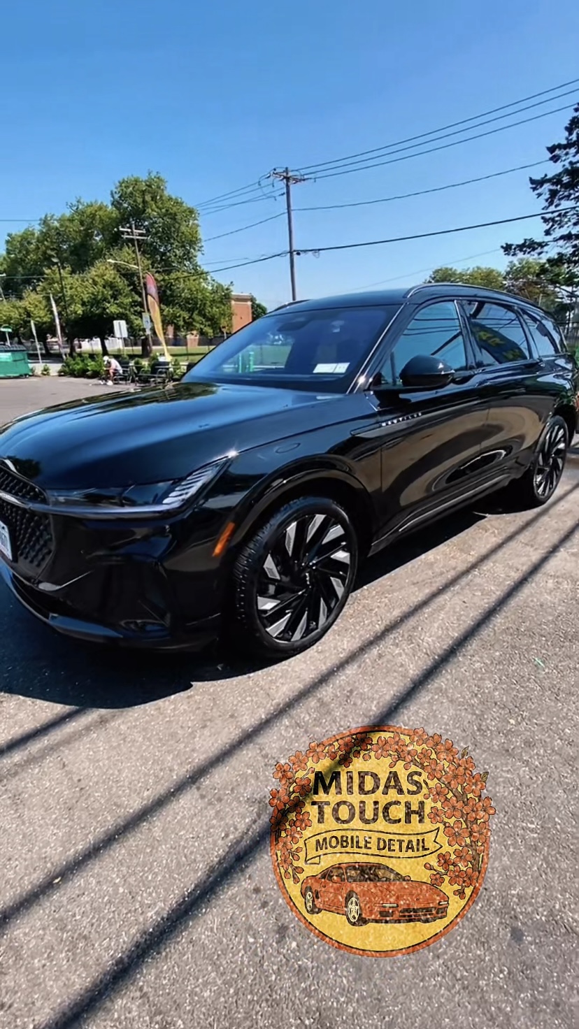 Black luxury SUV with mirror finish